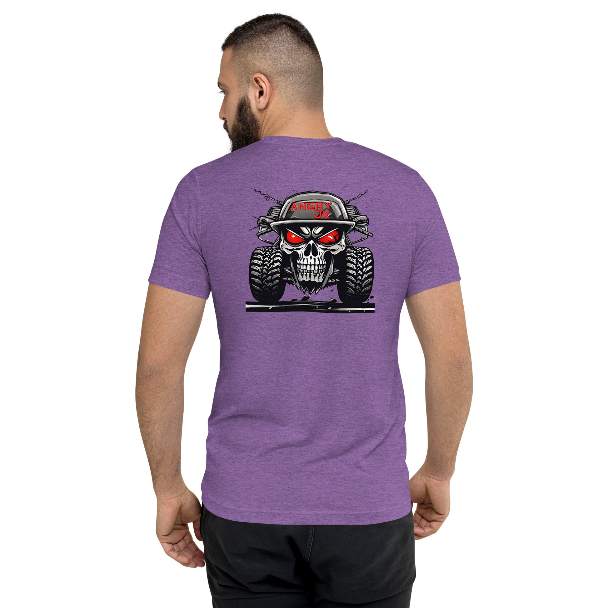 a man wearing a purple shirt with a skull on it