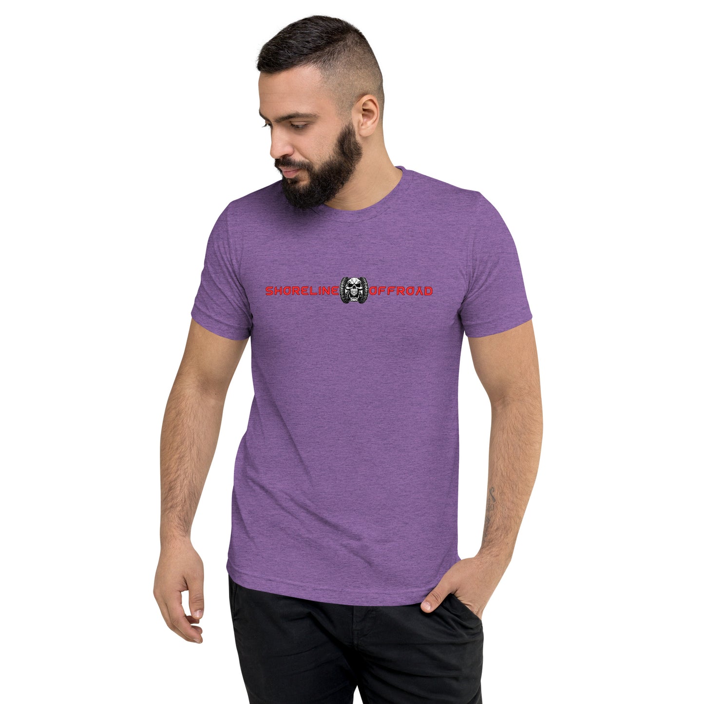 a man with a beard wearing a purple shirt