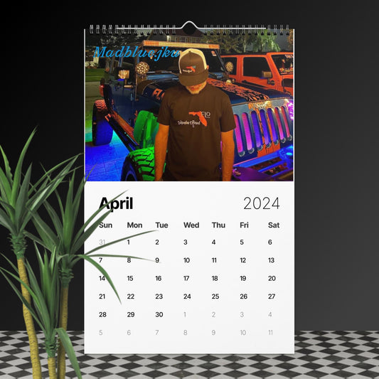 a calendar with a man standing next to a plant
