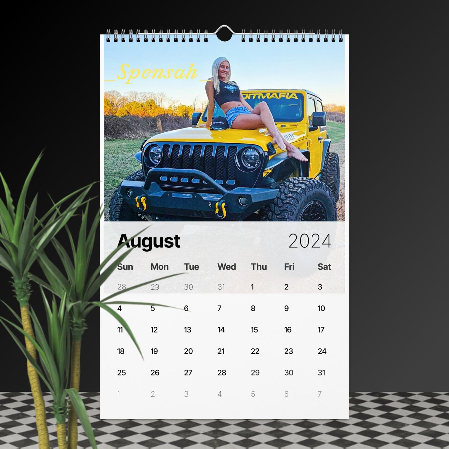 a calendar with a photo of a woman on a jeep