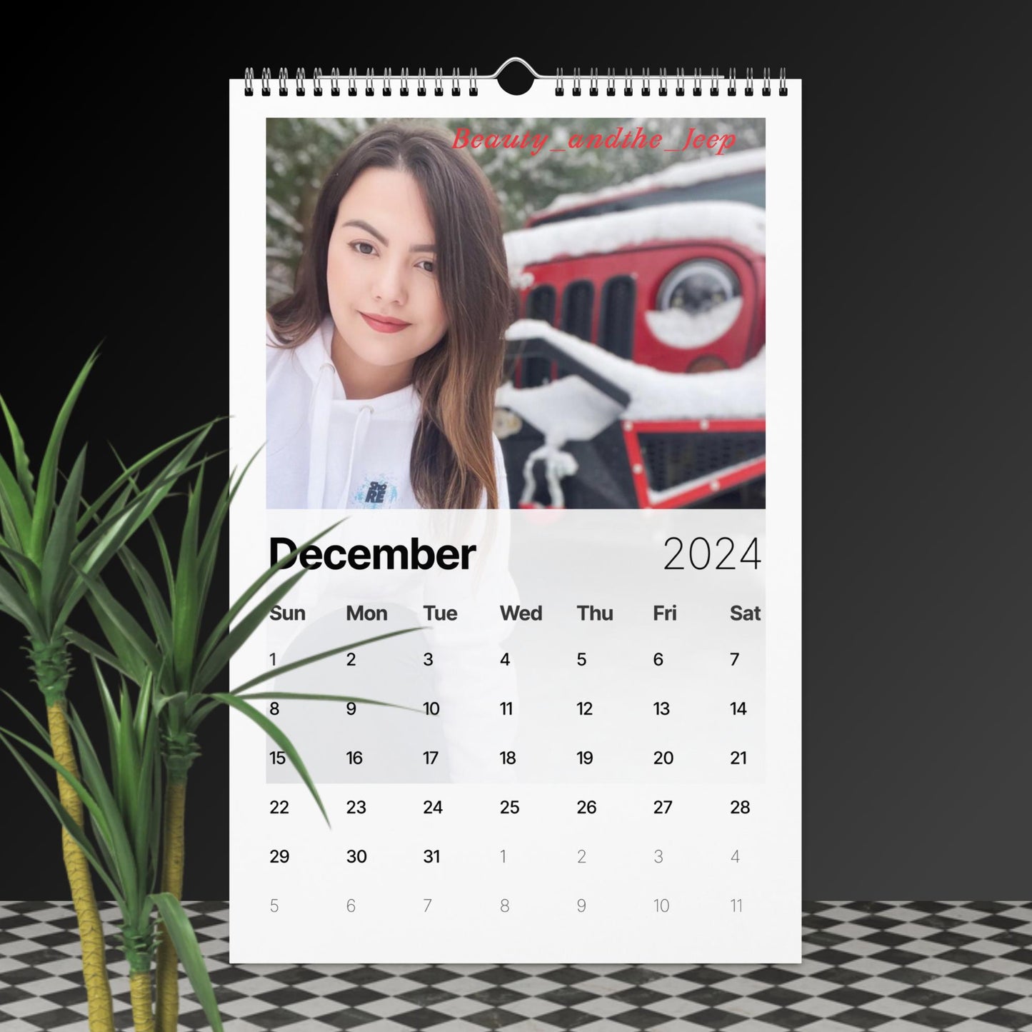 a desk calendar with a photo of a woman