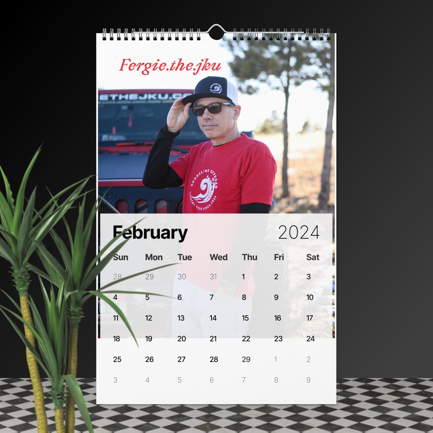 a calendar with a photo of a man in a red shirt