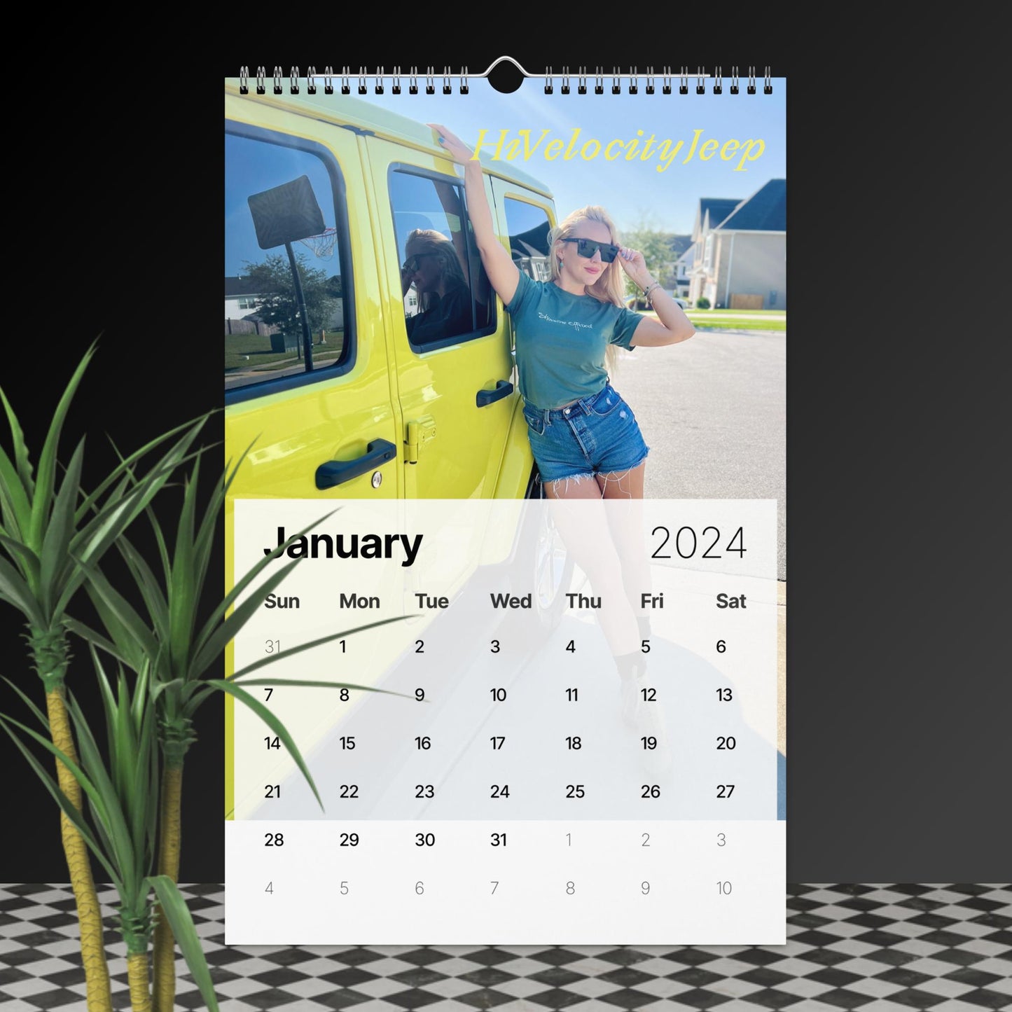 a calendar with a woman standing next to a yellow truck