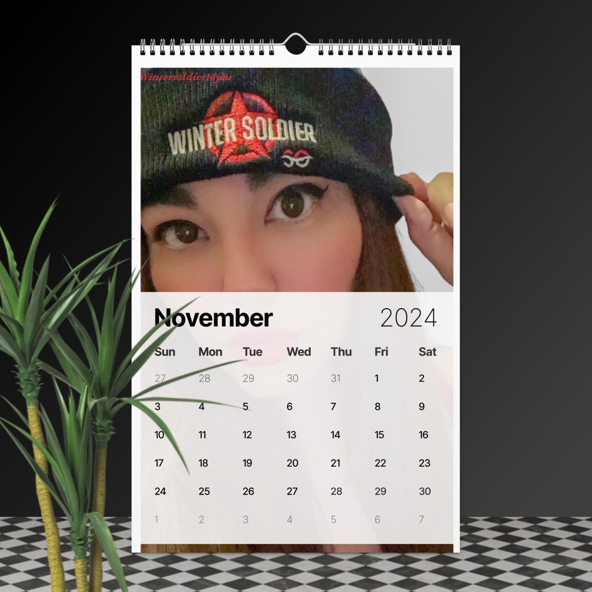 a calendar with a picture of a woman wearing a hat