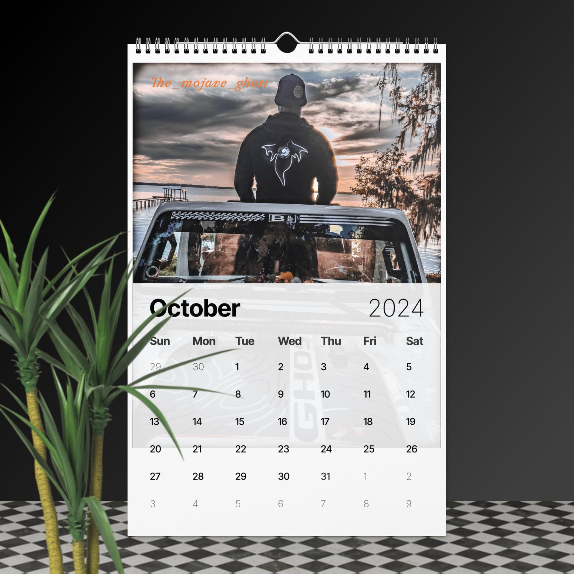 a calendar with a photo of a man in a hoodie