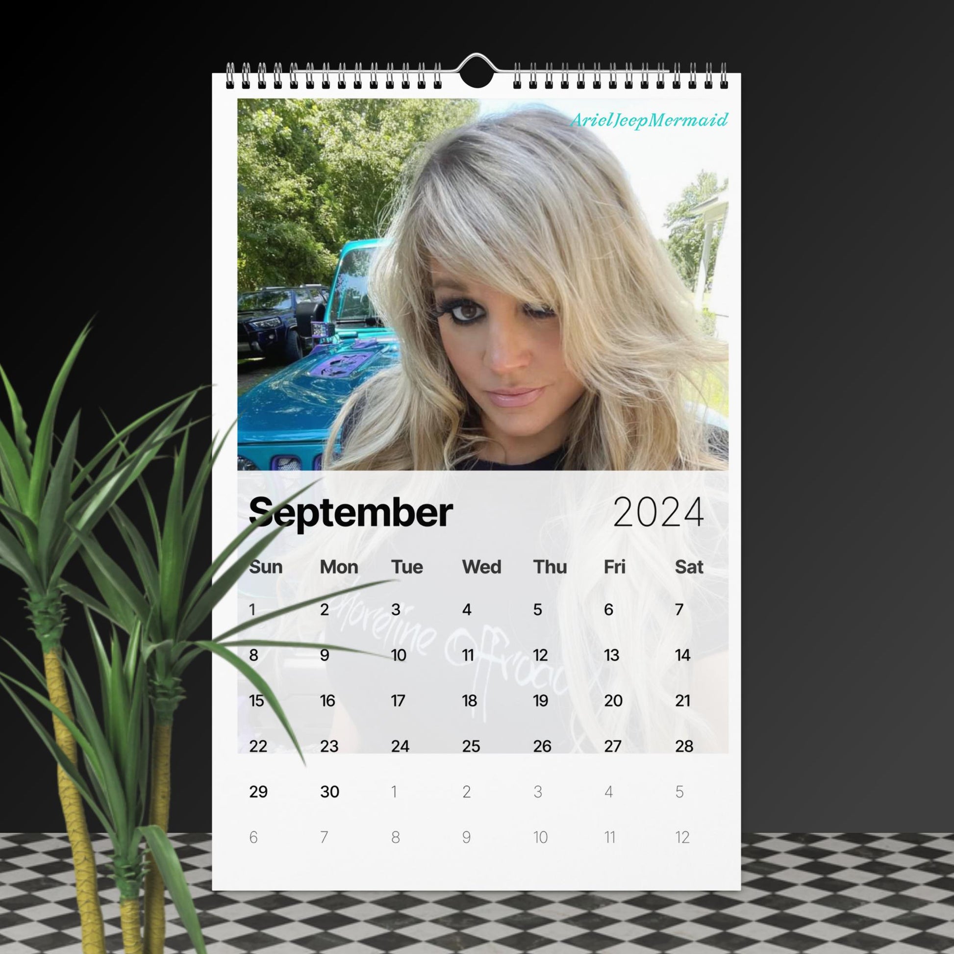 a calendar with a photo of a woman next to a plant