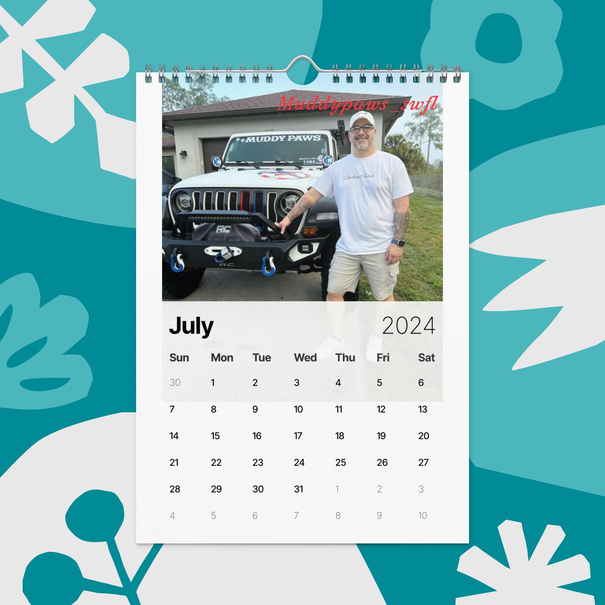 a calendar with a photo of a man standing next to a jeep