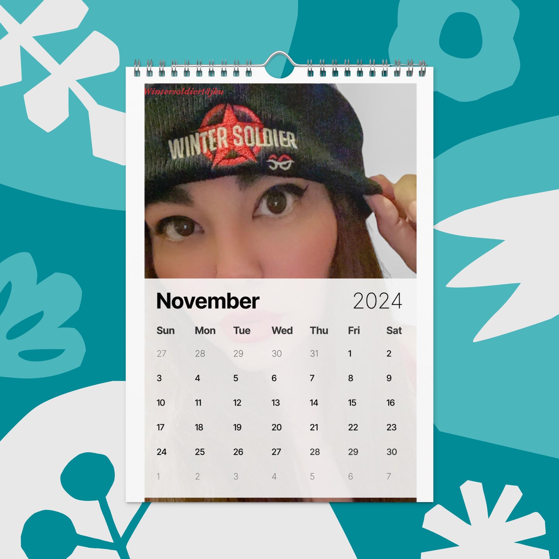 a calendar with a picture of a woman wearing a hat