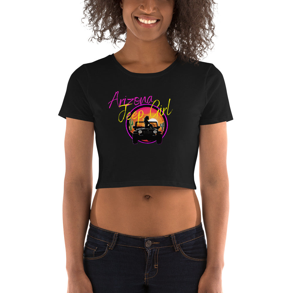 a woman wearing a black crop top with an afro girl on it