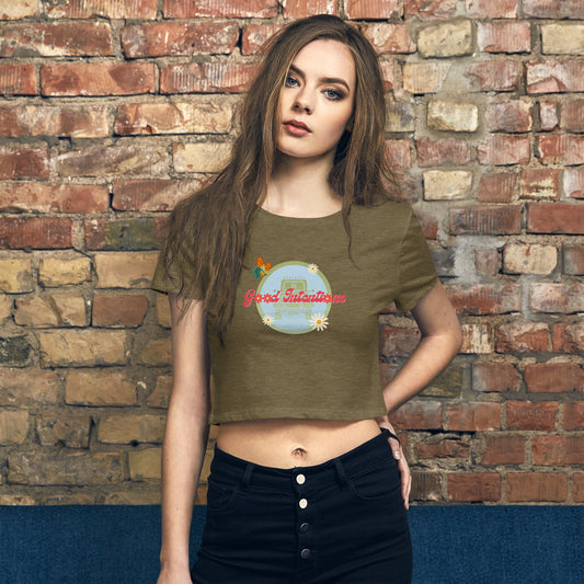 a woman standing in front of a brick wall