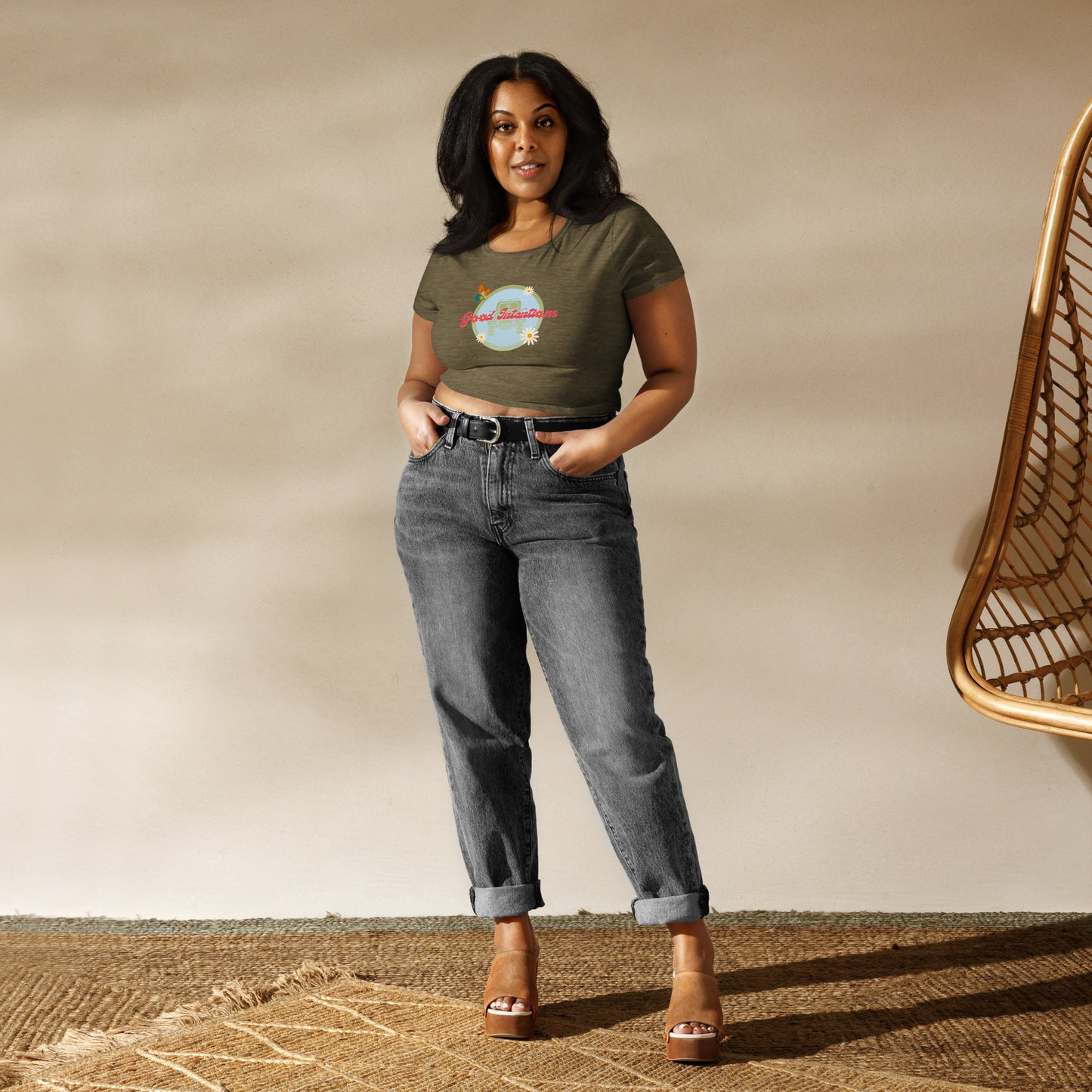 a woman standing in front of a wicker chair