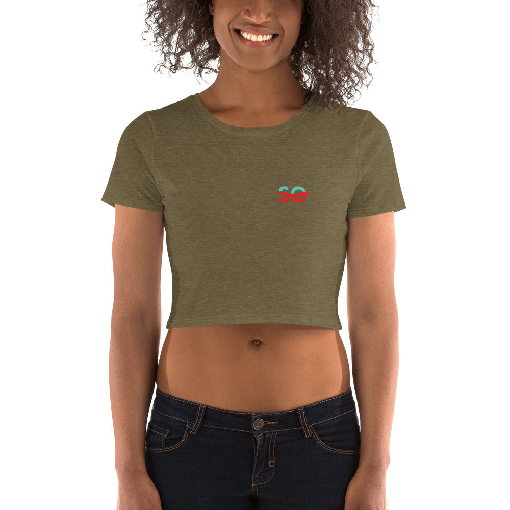 a woman wearing a crop top with a heart on it