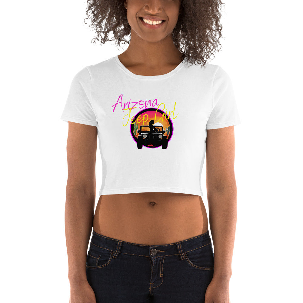 a woman wearing a white crop top with an image of a truck