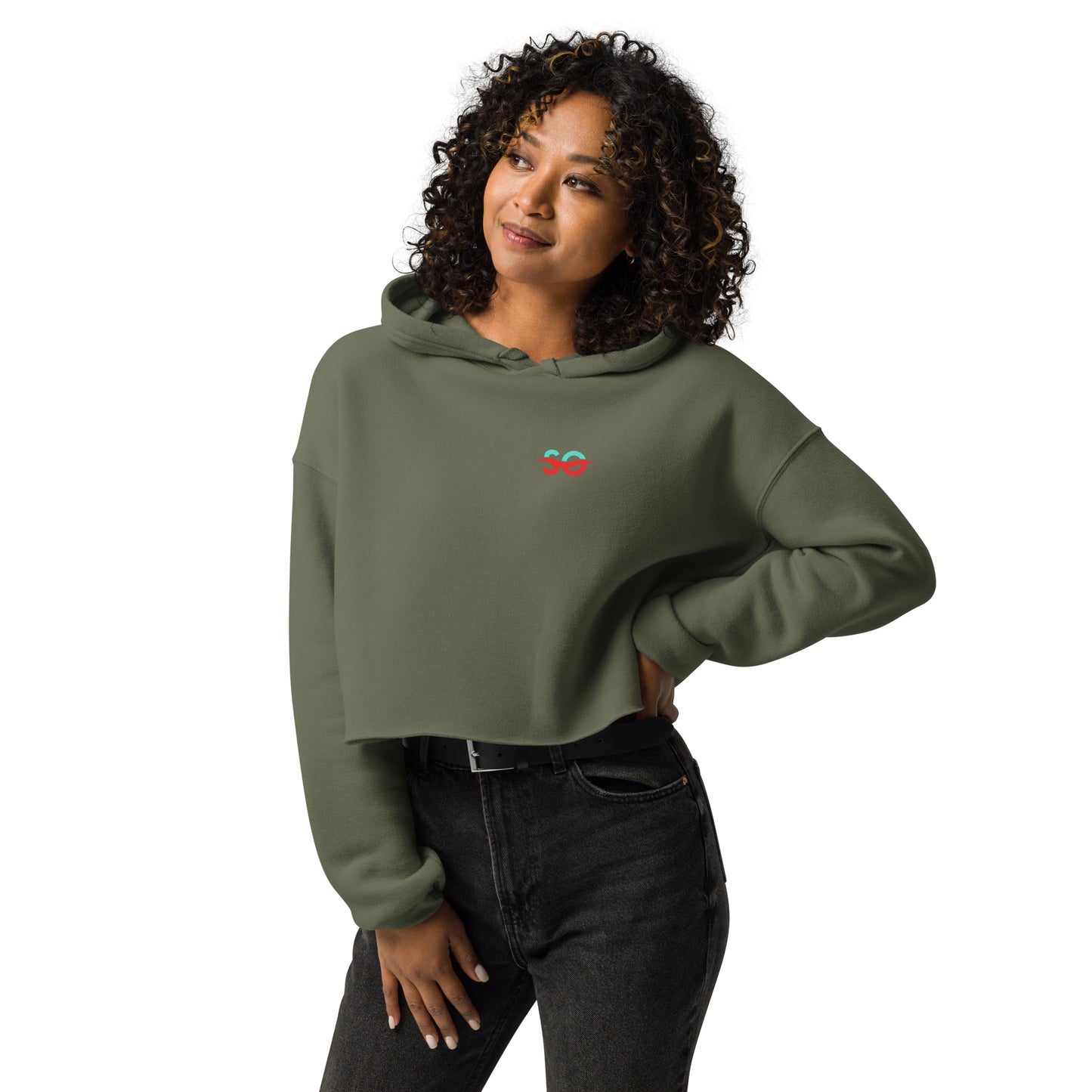 a woman wearing a green sweatshirt with a red heart on it