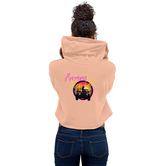 a woman wearing a pink hoodie with an image of a car on it