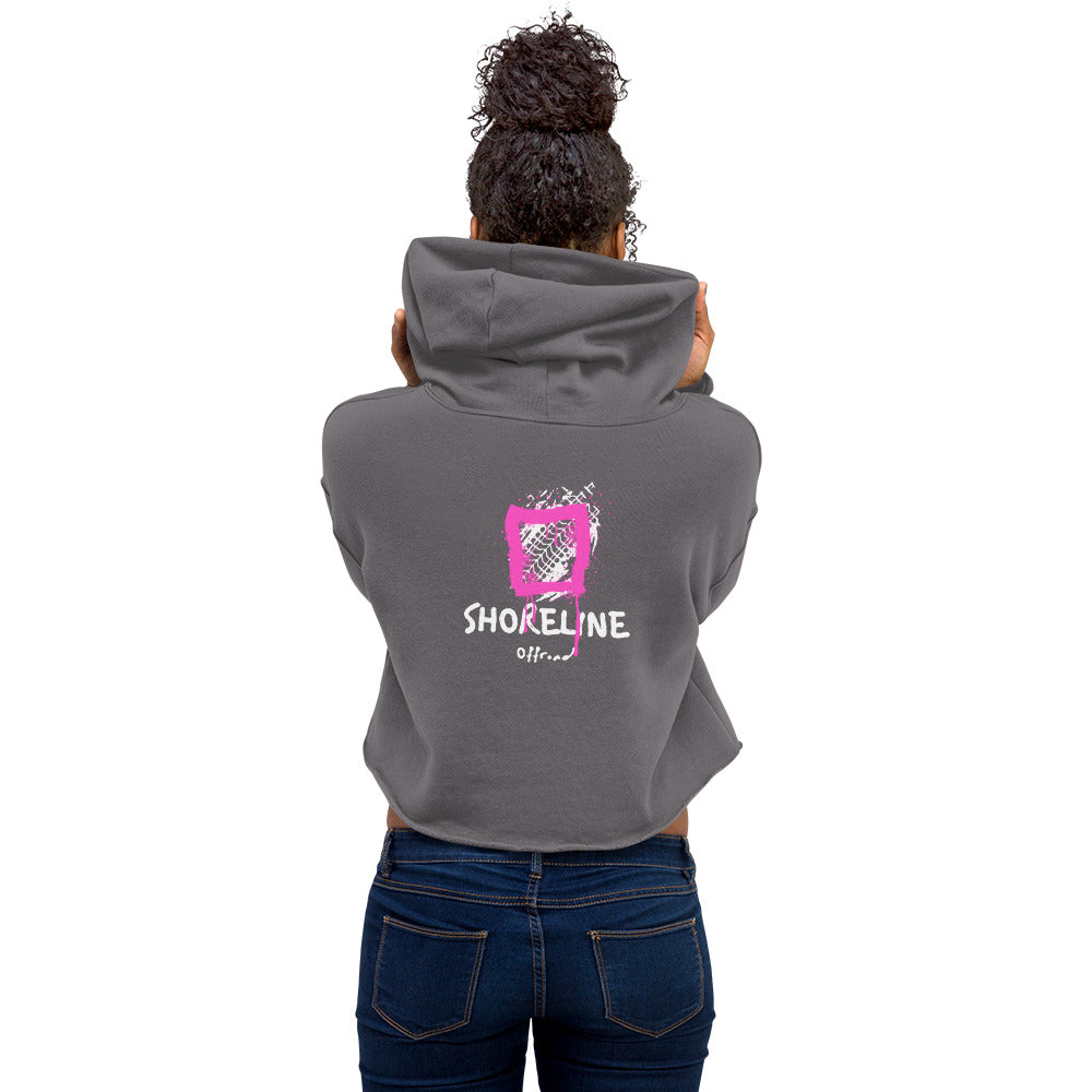 the back of a woman's hoodie with a pink heart on it