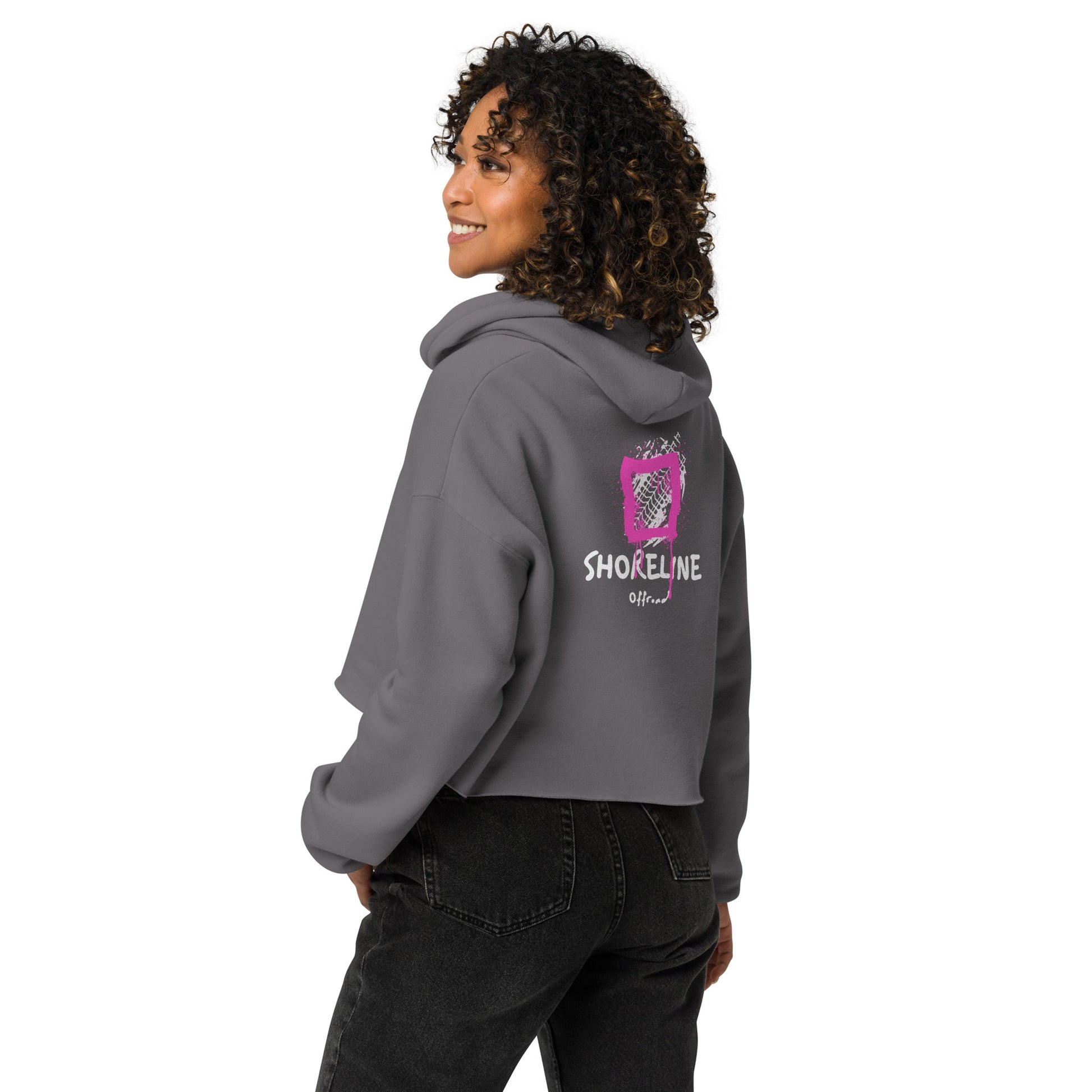 a woman wearing a grey hoodie with the word shoeline on it