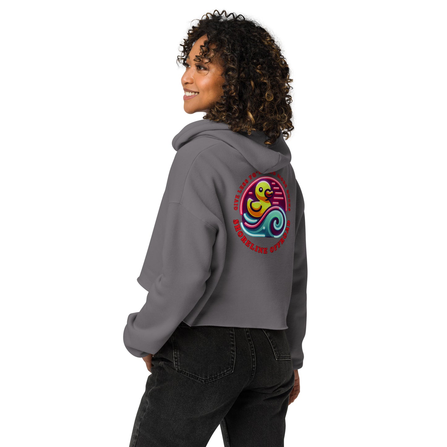 a woman wearing a grey hoodie with a colorful design on it