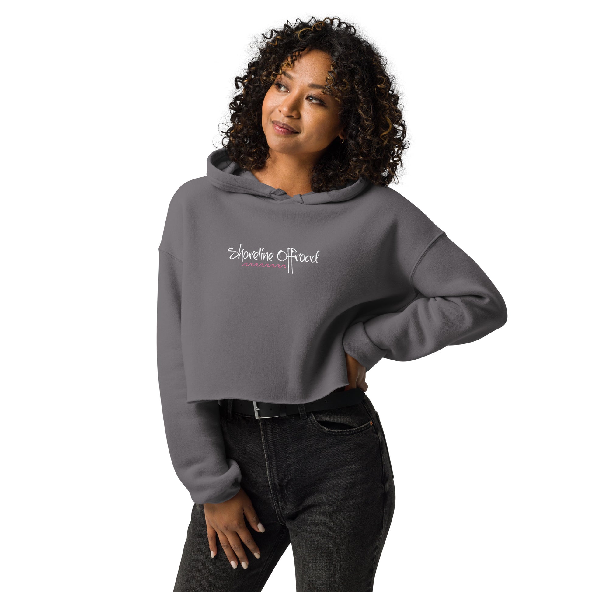 a woman wearing a grey sweatshirt with white lettering