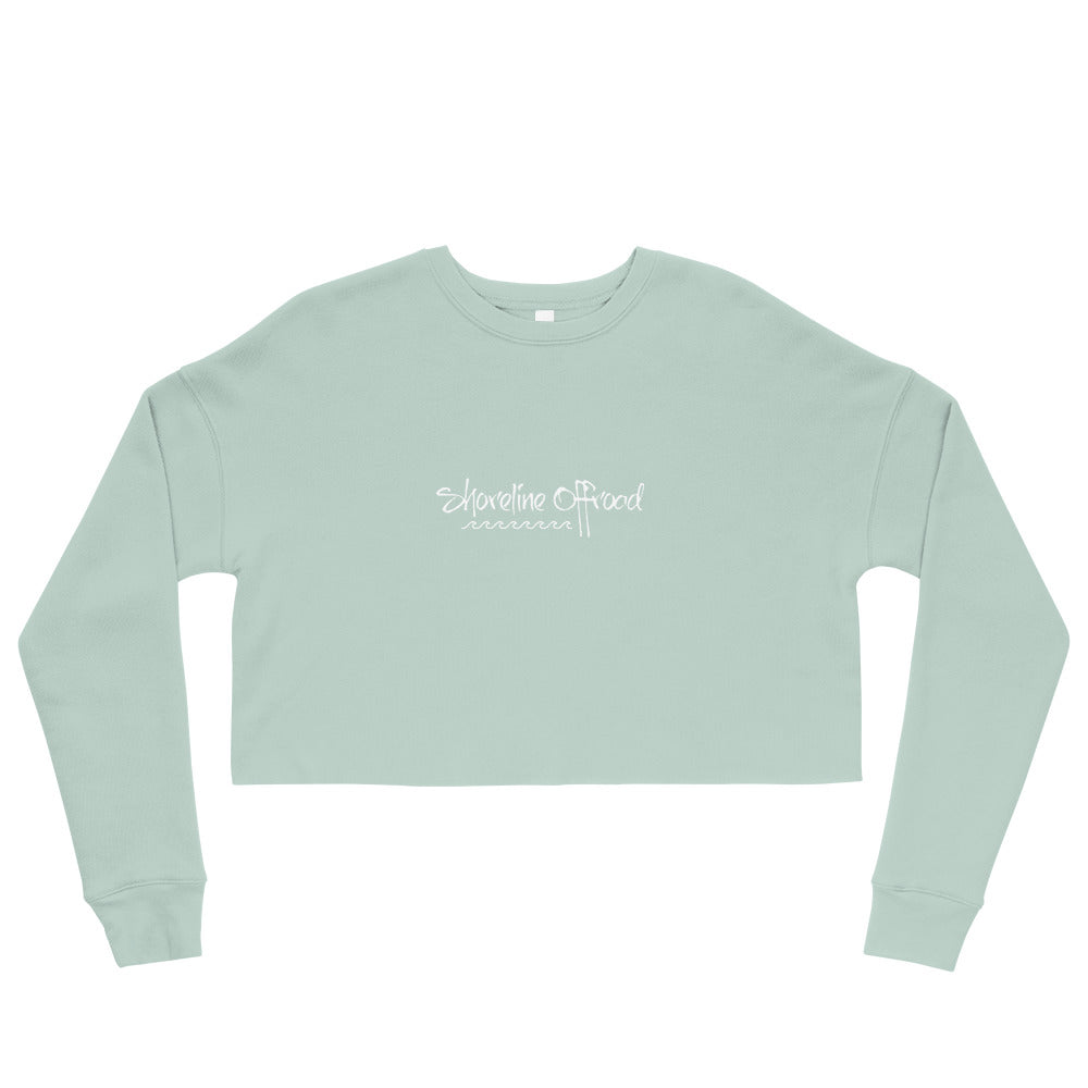 a light green crop top with the words somewhere church on it