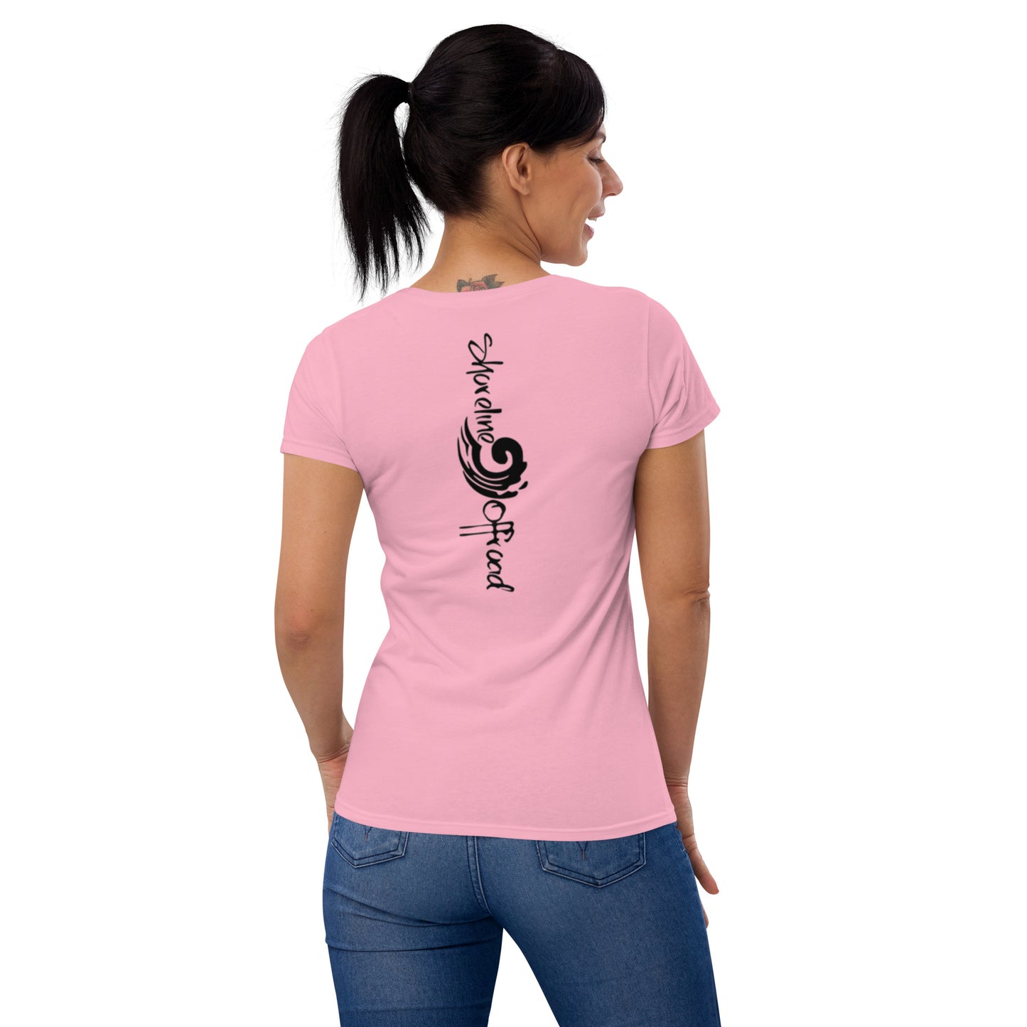 a woman wearing a pink t - shirt with a dragon on it