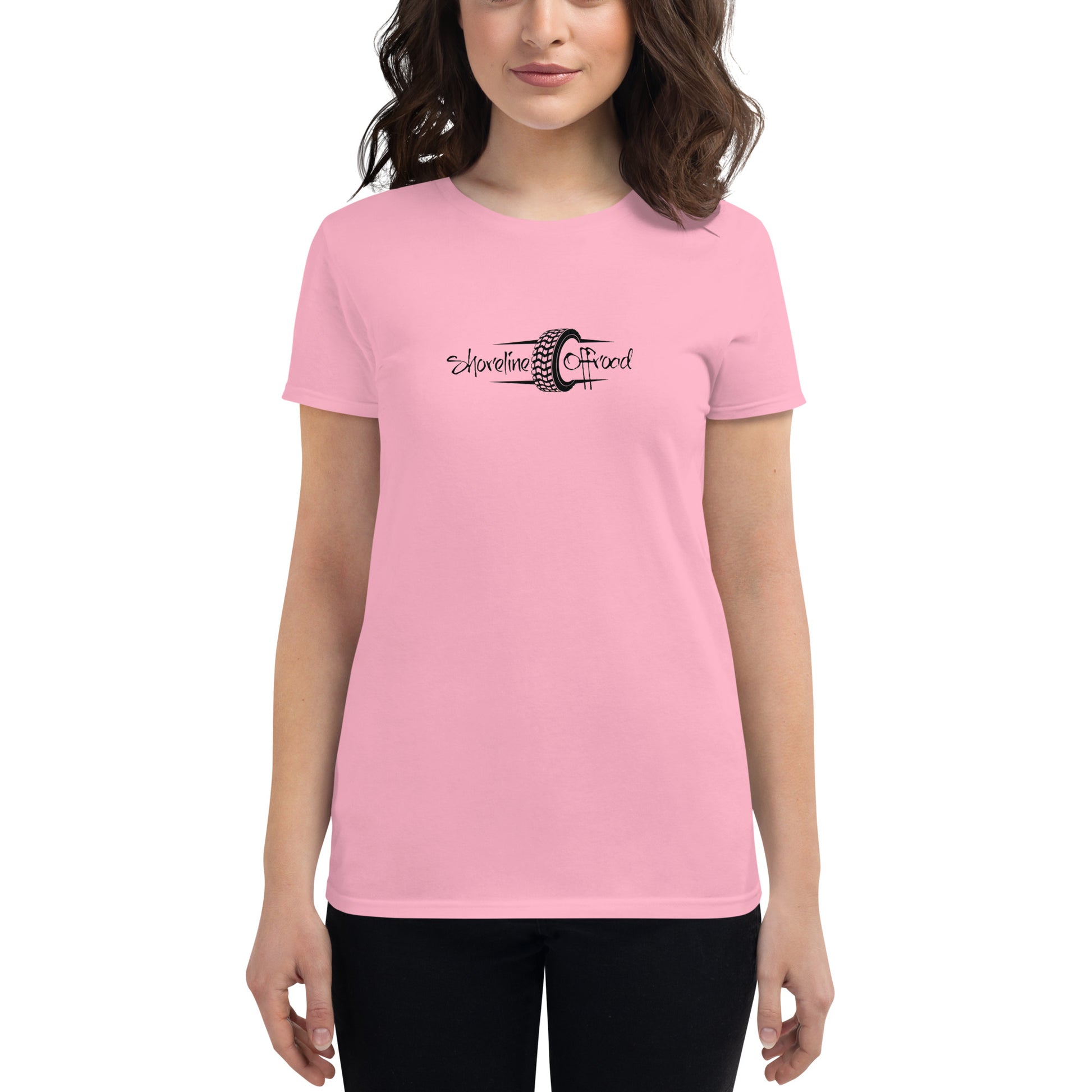 a woman wearing a pink t - shirt with a black and white logo