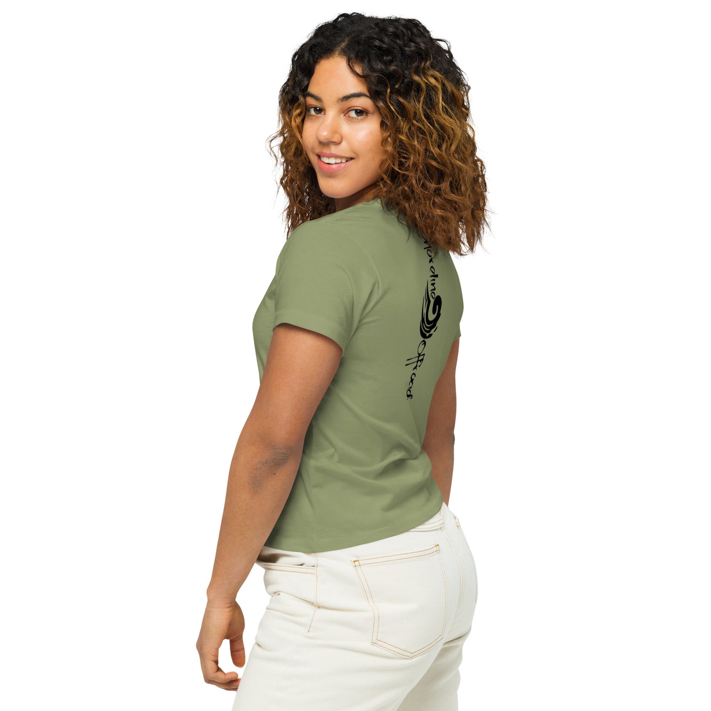 a woman wearing a green shirt and white pants