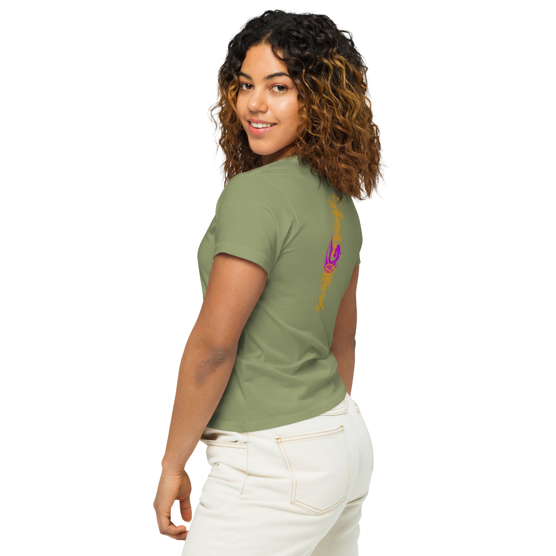 a woman wearing a green shirt and white pants