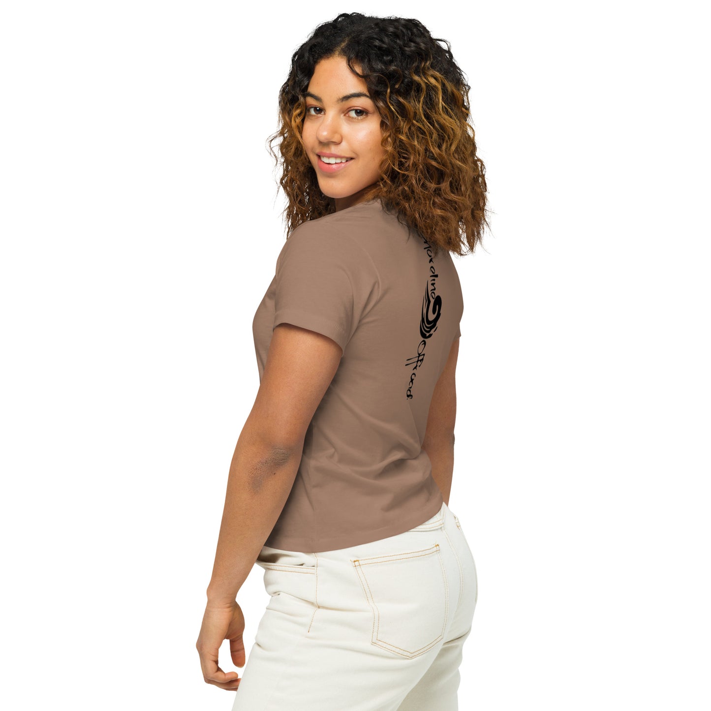 a woman wearing a brown shirt and white pants