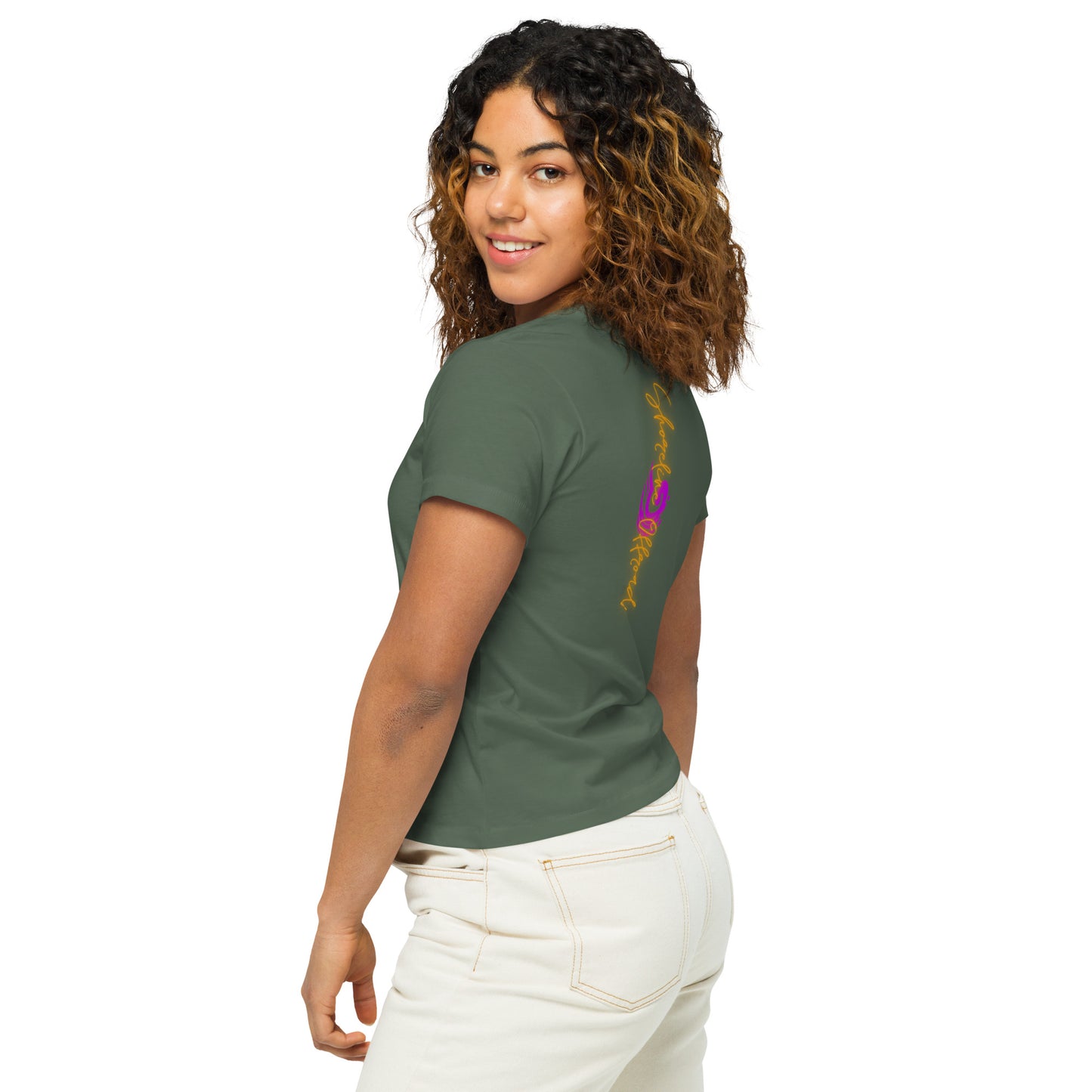 a woman with curly hair wearing a green shirt