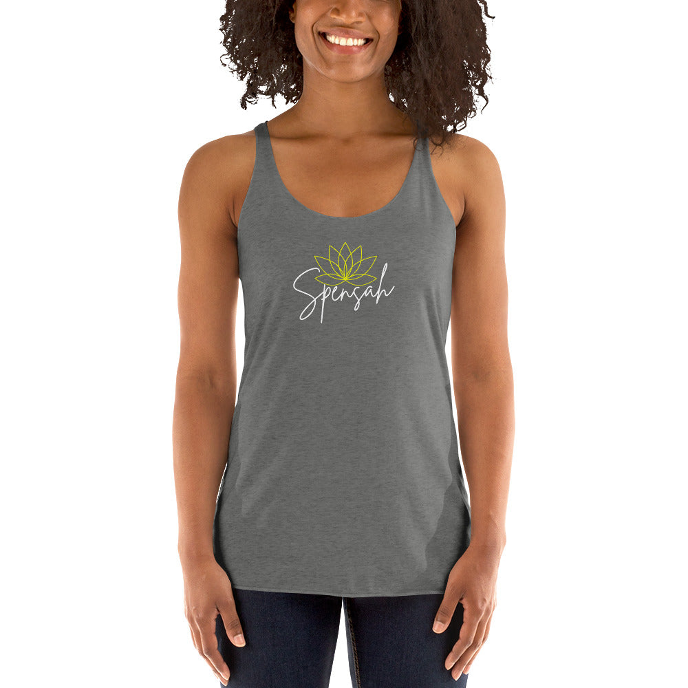 a woman wearing a gray tank top with a green flower on it