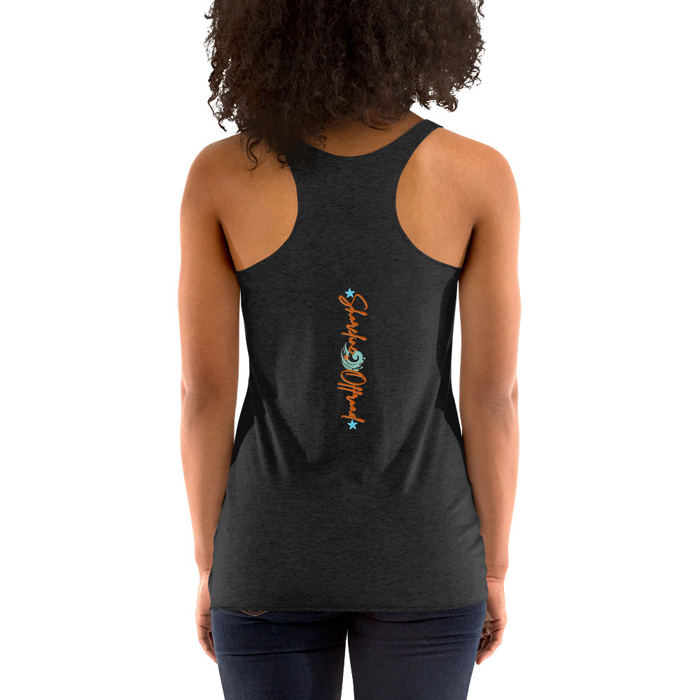 a woman wearing a black tank top with a colorful fish on it