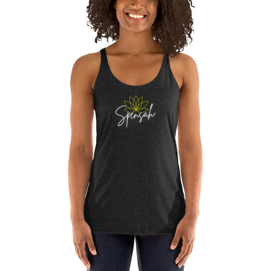 a woman wearing a black tank top with a flower on it