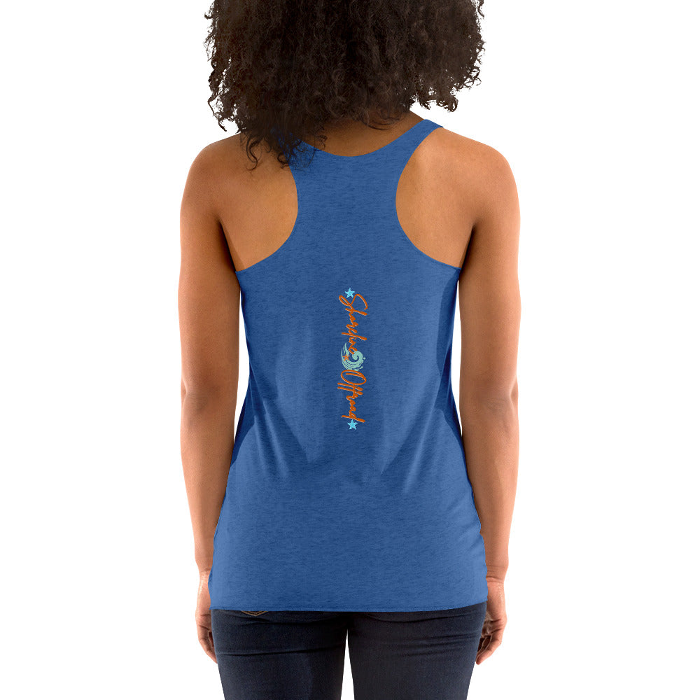 a woman wearing a blue tank top with a fish on it