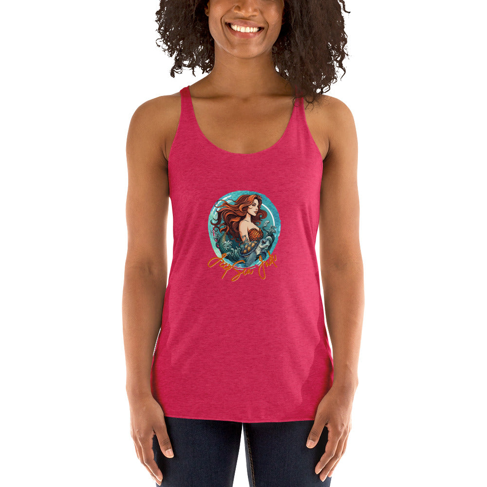 a woman wearing a pink tank top with a picture of a mermaid