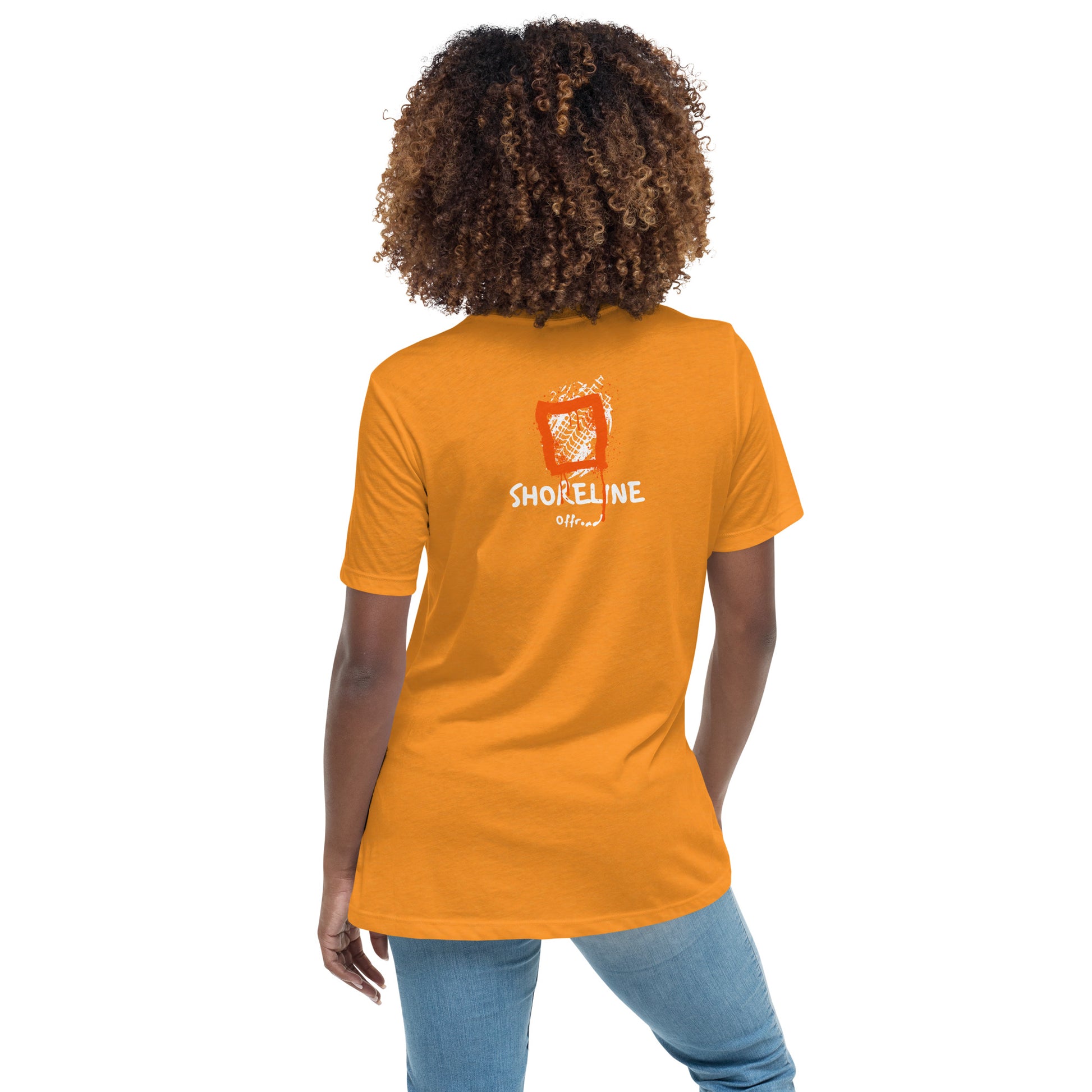 a woman wearing an orange t - shirt that says shine line