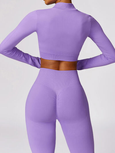 a woman in a purple outfit with her back to the camera
