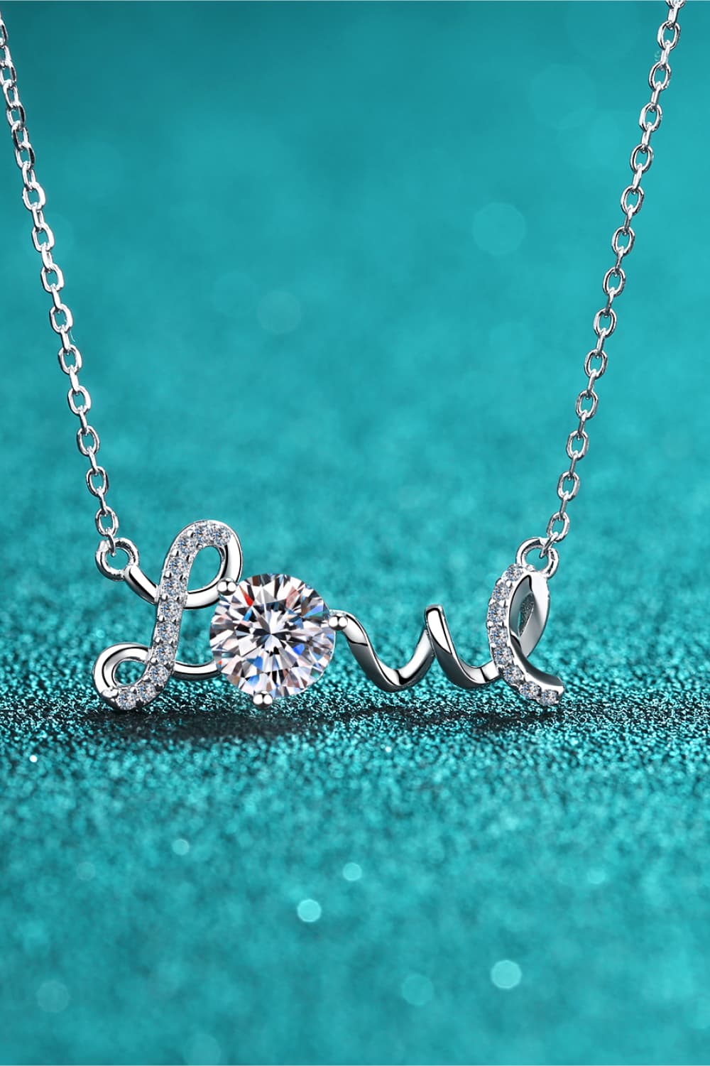 a necklace with the word love written on it