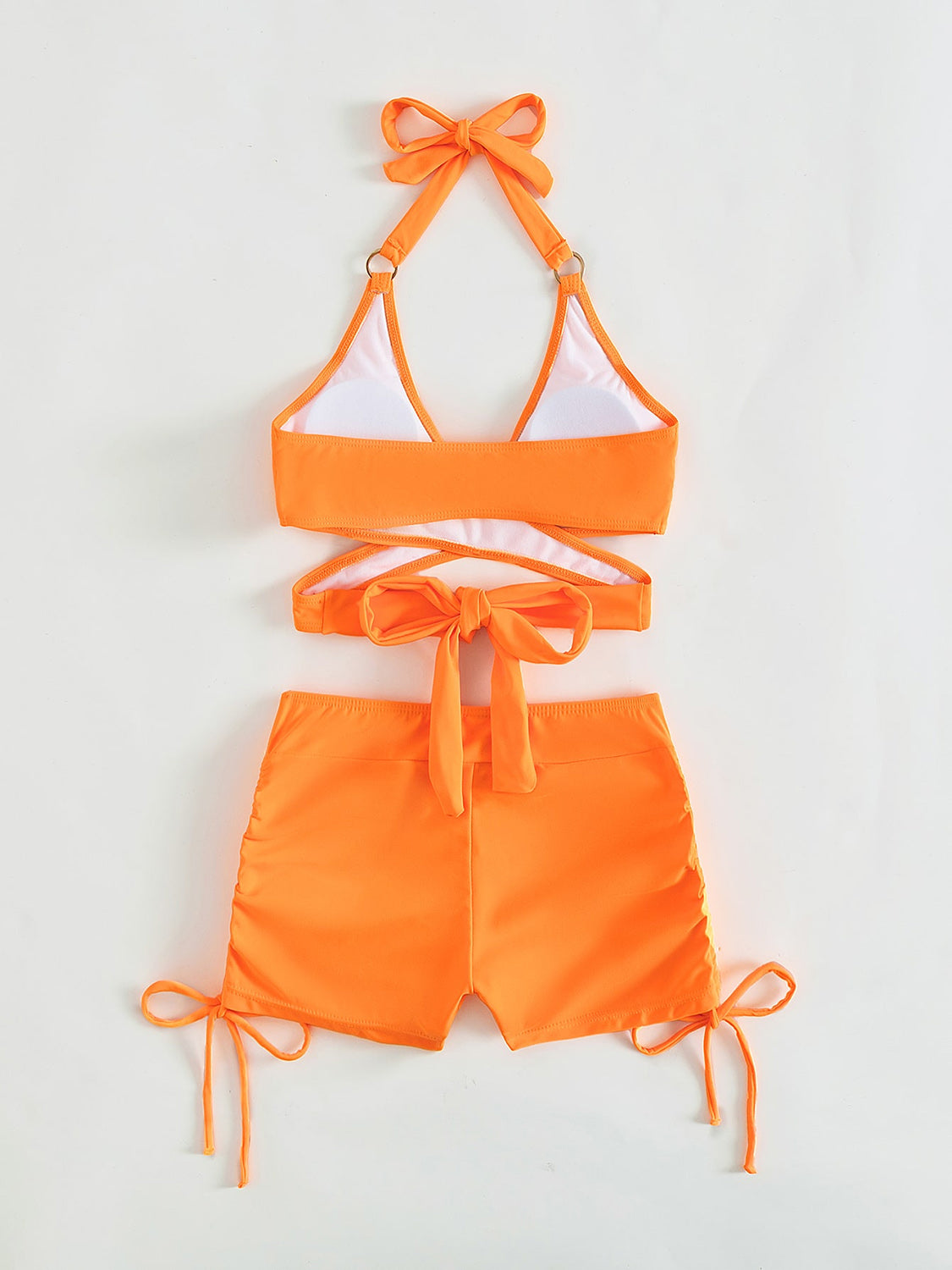 an orange and white bikini top and shorts