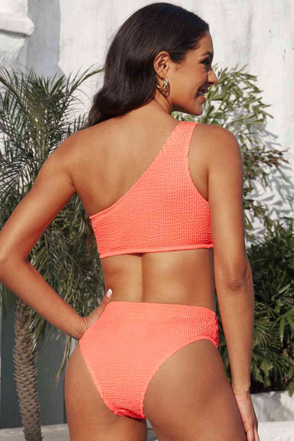 a woman in a bikini top and bottom