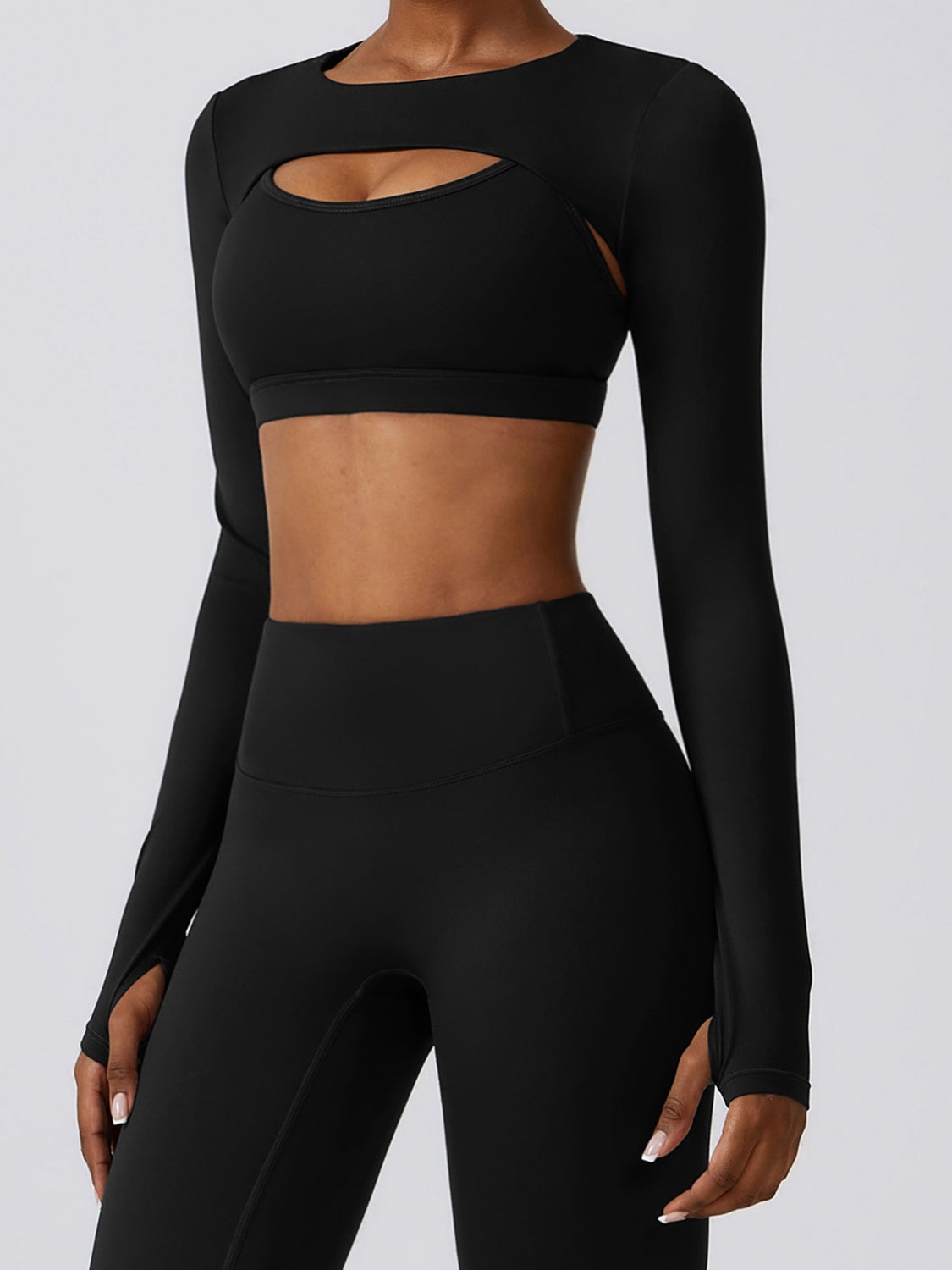 a woman in black sports bra top and leggings