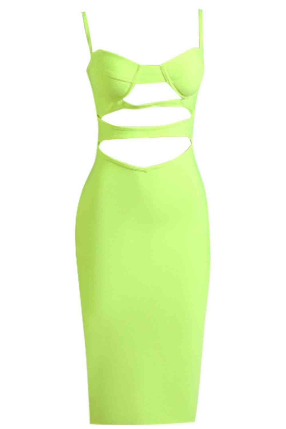 a green dress with cut outs on it