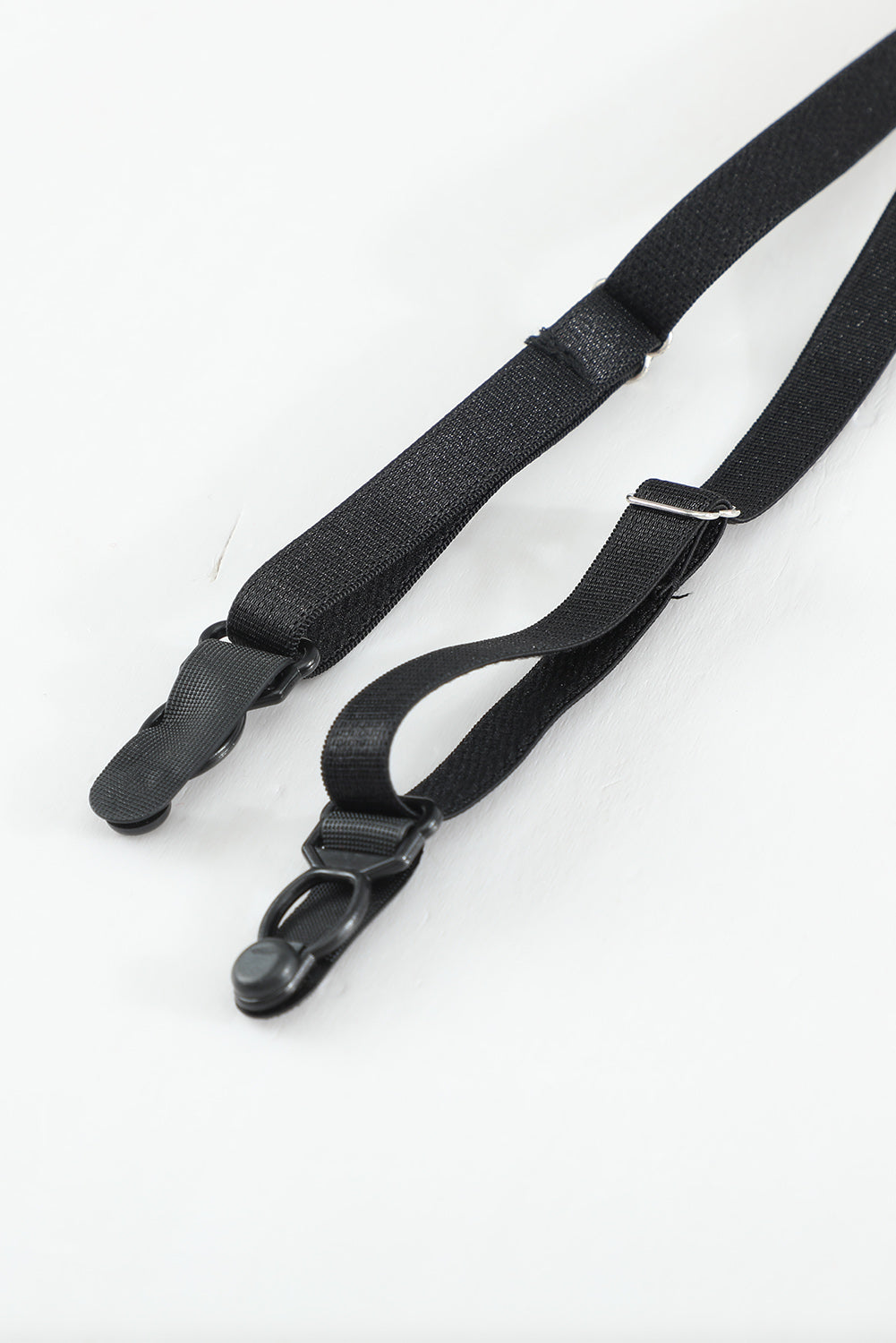 a pair of black straps on a white background
