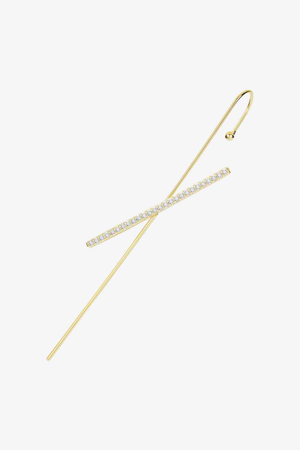 a pair of gold and diamond hair pins