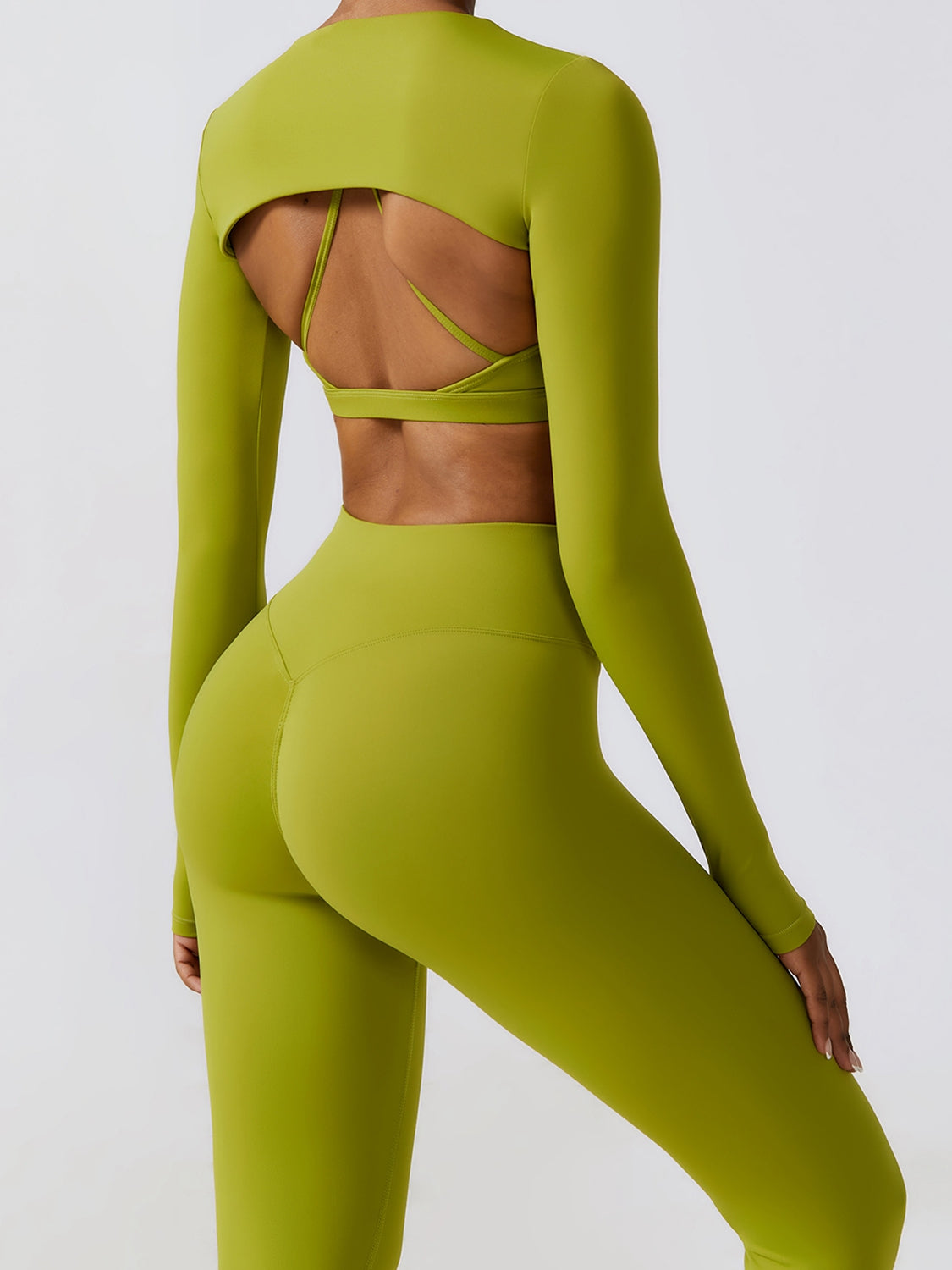 the back of a woman in a lime green sports suit
