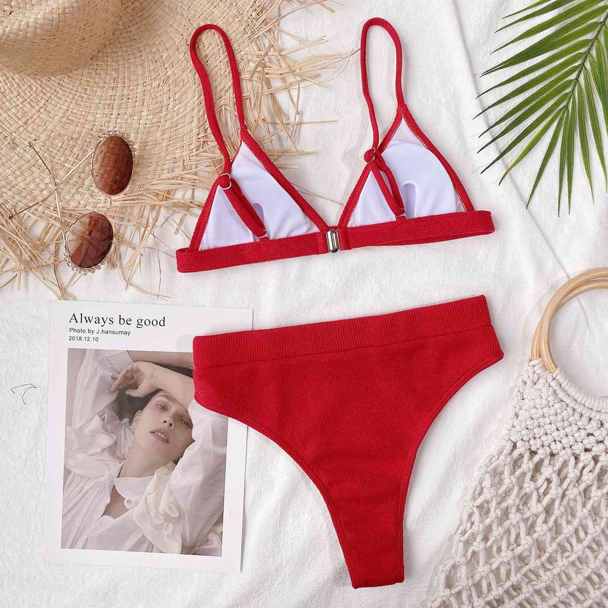 a woman's red and white bikinisuit with a picture of a woman in