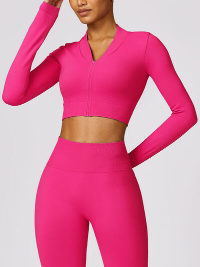 a woman in a bright pink sports suit