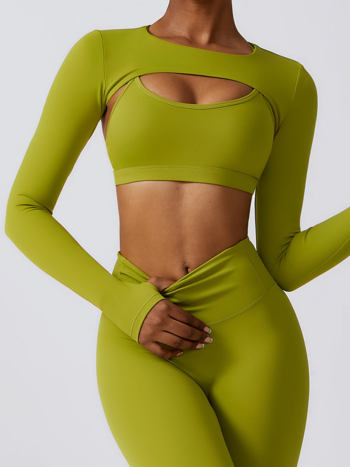a woman in a lime green sports bra top and leggings